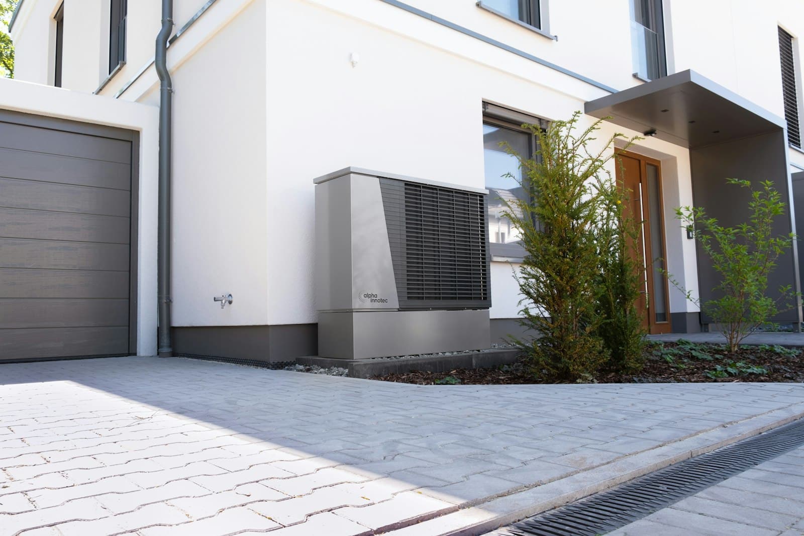 A heat pump unit outside a modern house