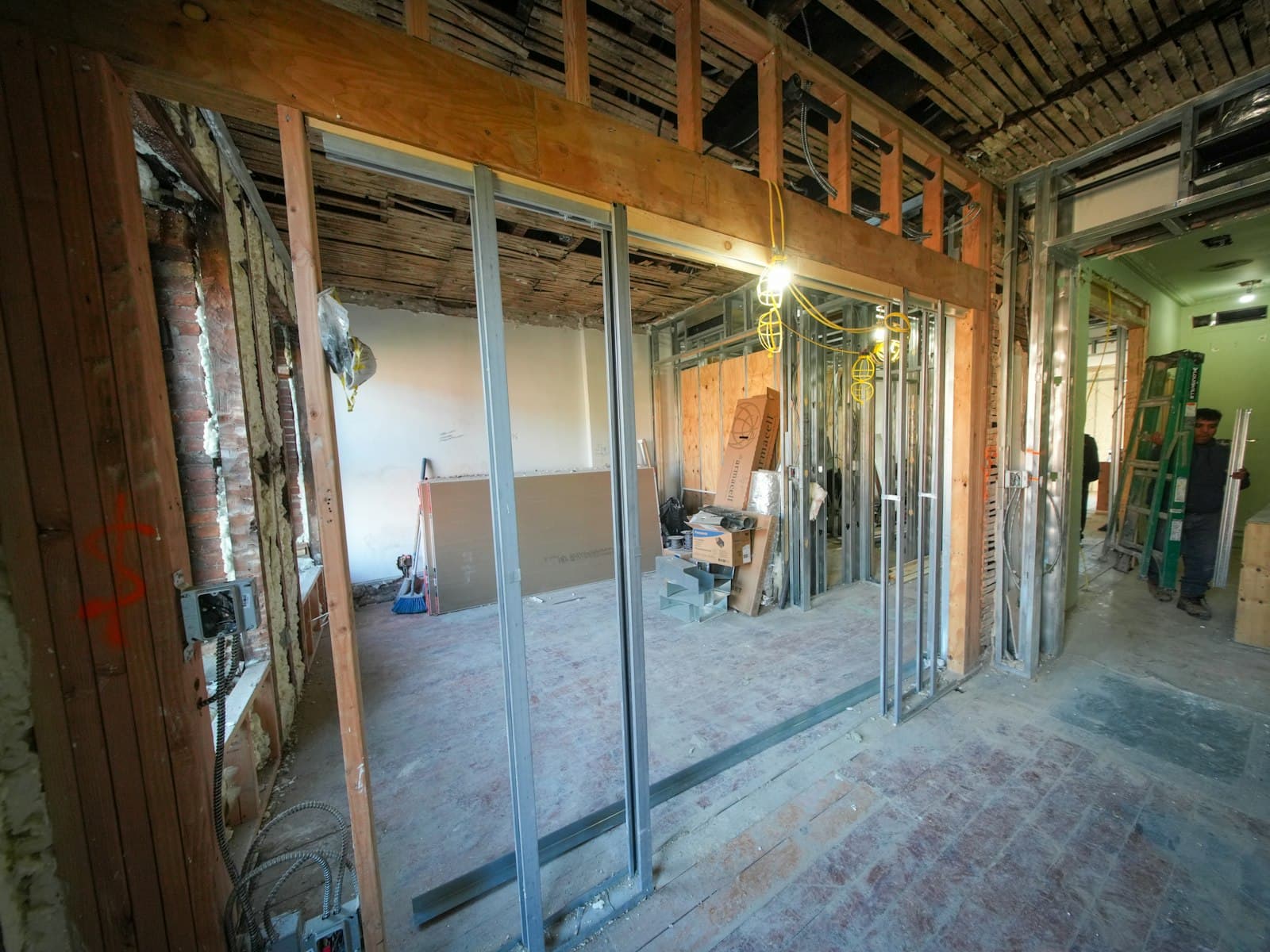 Interior renovation with exposed beams and framing